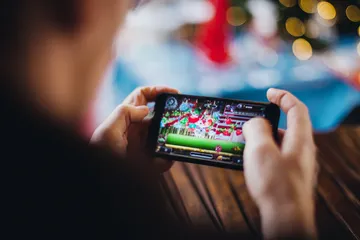 9777BEF Live Casino — Join thrilling real-dealer tables A professional dealer in a tuxedo greeting players at the roulette table, symbolizing the authentic live casino feel at 9777BEF.